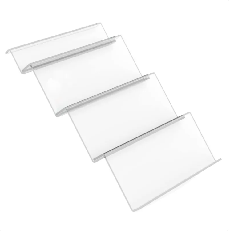 Clear four-tier acrylic drawer insert with angled rows for organizing spice jars