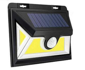 Black outdoor solar wall light with a top solar panel and front and side light panels